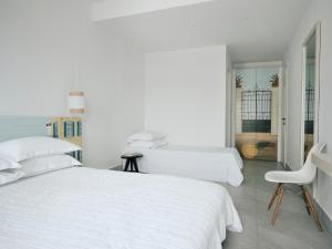 Voodi või voodid majutusasutuse Acteon Hotel toas