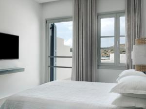 Voodi või voodid majutusasutuse Acteon Hotel toas