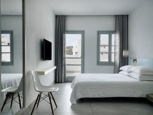 Voodi või voodid majutusasutuse Acteon Hotel toas
