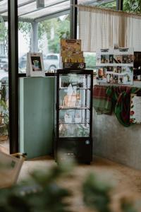 a small refrigerator in a room with a counter at Shanti-Retreat Hotel in Pua
