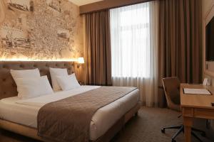 Cama ou camas em um quarto em CALVARY Hotel & Restaurant Vilnius