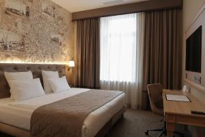 Cama ou camas em um quarto em CALVARY Hotel & Restaurant Vilnius