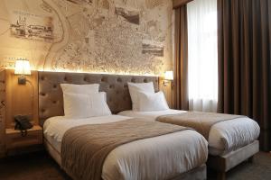 Cama ou camas em um quarto em CALVARY Hotel & Restaurant Vilnius