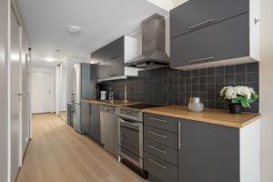 Η κουζίνα ή μικρή κουζίνα στο Aurora Wave Residence +10 φωτογραφίες