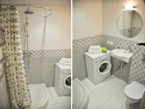 a bathroom with a toilet sink and a washing machine at PaulMarie Apartments on Masherova 11 in Brest +12 photos
