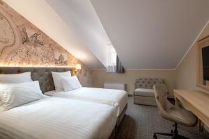 Cama ou camas em um quarto em CALVARY Hotel & Restaurant Vilnius