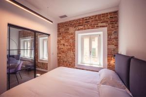 Voodi või voodid majutusasutuse Suite Design & Spa toas