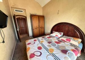 Ένα ή περισσότερα κρεβάτια σε δωμάτιο στο Appartement avec Piscine et Proche des Plages