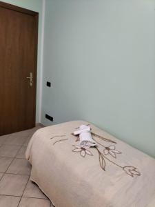 A bed or beds in a room at Hotel Grazia Ristorante
