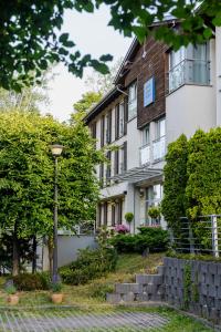 a building with a street light in front of it at Hotel Aqua Sopot - Destigo Hotels in Sopot