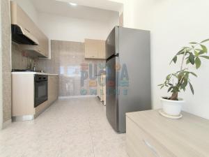 A kitchen or kitchenette at Appartamento La Torre piano terra sul mare Puglia On line