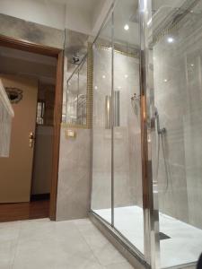 a shower with a glass door in a bathroom at Ca' Dell' Arte Luxury in Venice