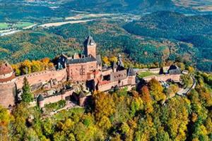 an old castle on top of a hill with trees at Europapark à 11km Maison Soleil climatisé in Friesenheim