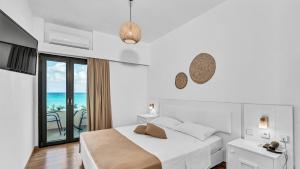 Postel nebo postele na pokoji v ubytování Sunset Beach Hotel + 37 fotografií