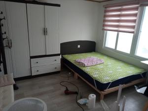 Postel nebo postele na pokoji v ubytování Ocean House - Ipjang