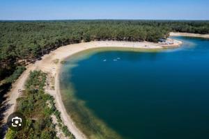 an aerial view of a beach and a body of water at Chalet Woef op de Veluwe in Doornspijk