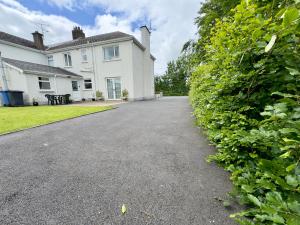a driveway in front of a house at Craigs Rock Cottage Cookstown in Cookstown