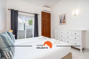 a bedroom with a bed and a mirror at #245 Quinta do Julo by Home Holidays in Albufeira +57 photos
