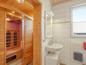 a bathroom with a sink and a shower at Holiday Home Achterblick 2 by Interhome in Altefähr