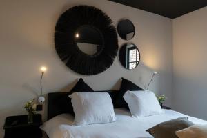 Una cama o camas en una habitación de 't Convent