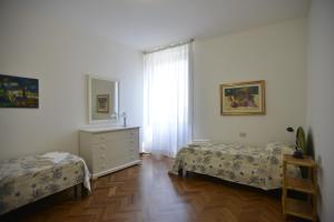 A bed or beds in a room at Casa Alice