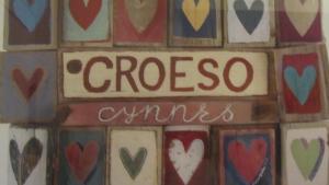 a tile wall with a sign that says crooser amps at Garth Engan Private Self Contained B&B with Garden Area in Llanbedr