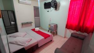 Postel nebo postele na pokoji v ubytování Hotel Gueicer Cucuta