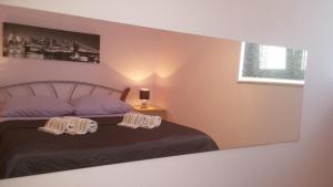 Cama o camas de una habitación en Apartments Roncevic
