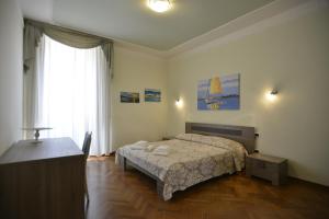 A bed or beds in a room at Casa Alice