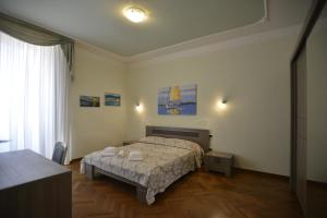 A bed or beds in a room at Casa Alice
