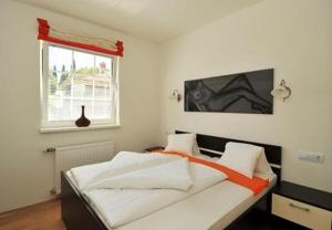 Posteľ alebo postele v izbe v ubytovaní Apartments Martin