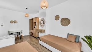 Postel nebo postele na pokoji v ubytování Sunset Beach Hotel