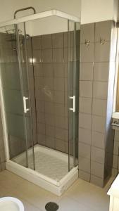 a shower with a glass door in a bathroom at VRS - PORTO BEACH FLAT in Porto +46 photos