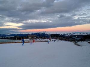 a group of people skiing on a snow covered slope at Studio cosy à Saint-Lary-Soulan, ski aux pieds - FR-1-296-330 in Saint-Lary-Soulan