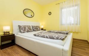 Posteľ alebo postele v izbe v ubytovaní Apartments Zeljko B