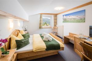 Postel nebo postele na pokoji v ubytování Gästehaus Edelweiss