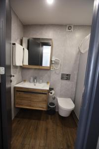 a bathroom with a sink and a toilet at Zendy Suite Hotel in Istanbul +63 photos