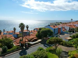 an aerial view of a town next to the ocean at Ventur Balcony in Caniço