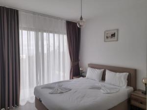Postel nebo postele na pokoji v ubytování Retreat, block A2, unit 3