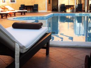 a mattress next to a swimming pool at Casa Alice in Rovinj