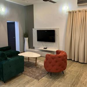 Un televizor și/sau centru de divertisment la GL Apartments