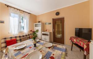 a living room with a couch and a table at Holiday Home Kature Iv in Labin