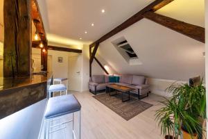 a living room with a couch and a table at City Centre Rooftop Knez Mihailova Apartment in Belgrade
