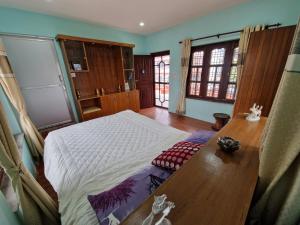 Ένα ή περισσότερα κρεβάτια σε δωμάτιο στο Ramanad House +4 φωτογραφίες