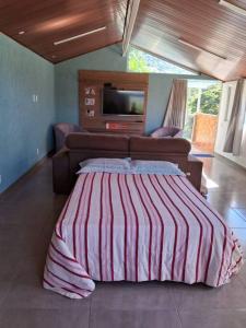 Voodi või voodid majutusasutuse Loft em Itaipava toas +4 fotot