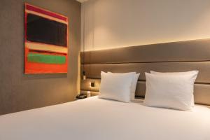 Voodi või voodid majutusasutuse Boutique Hotel Corona toas