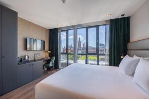 Voodi või voodid majutusasutuse Boutique Hotel Corona toas
