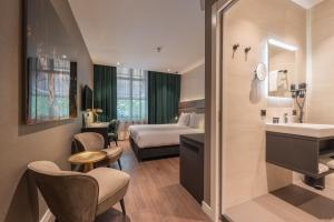 Voodi või voodid majutusasutuse Boutique Hotel Corona toas