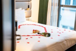 Voodi või voodid majutusasutuse Boutique Hotel Corona toas