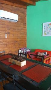 a living room with a table and a couch at Cabaña bruji in Tigre